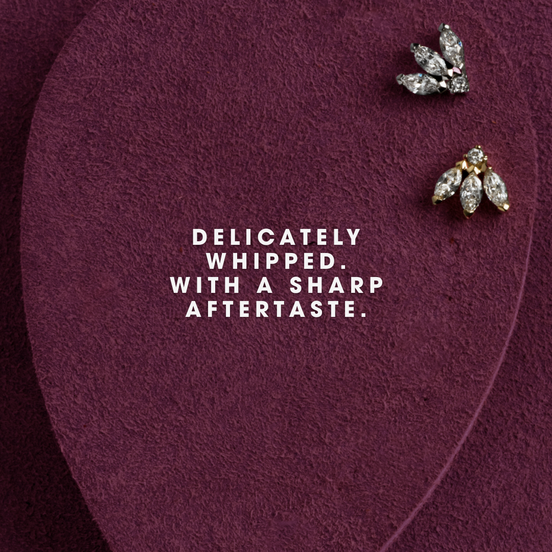 2 cartilage earrings on a prop ear