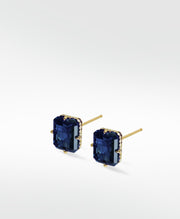 A pair of London Bridge stud earrings with rectangular blue sapphires and pavé diamonds in a yellow gold setting.