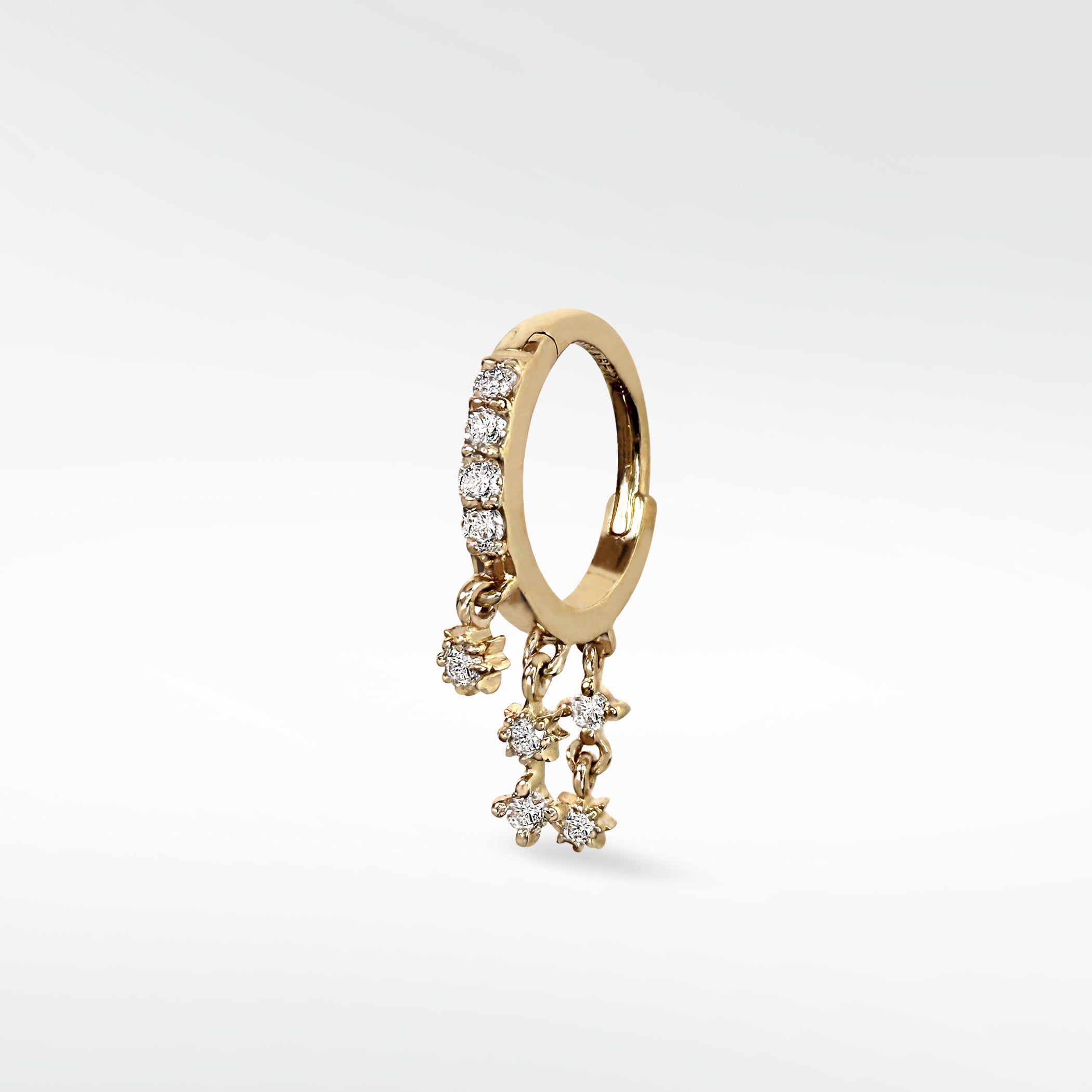 Lark & Berry Modernist Celestial Drop Hoop earring in gold with pavé diamonds and dangling star charms.