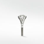 Side profile of the Torreya Diamond Engagement Ring in platinum, showcasing its twisting pavé diamond band.
